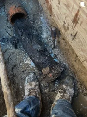 Real excavation exposing a private sewer lateral